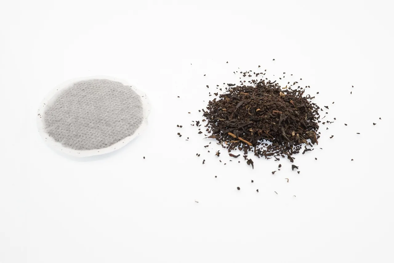 tea, teabag, black, nature, broken, leaves, loose, dried, beverage, drink, text, breakfast, spoon, infusion, coziness, teatime, contrast, modern, traditional, aroma, circle, round. The package format decides tea brewing methods before any label does